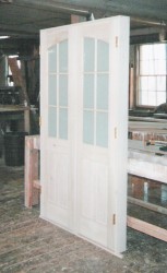 Interior storm doors with decorative and clear glass doors