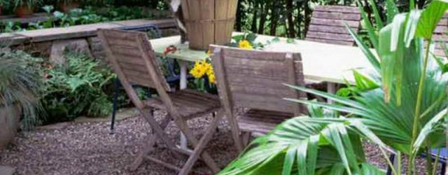 Gravel Ideas for Backyard Landscaping with with wood chairs Enclosed