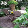 Gravel Ideas for Backyard Landscaping with with wood chairs Enclosed